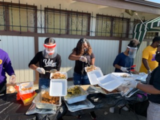 Volunteers serving food in Compton.